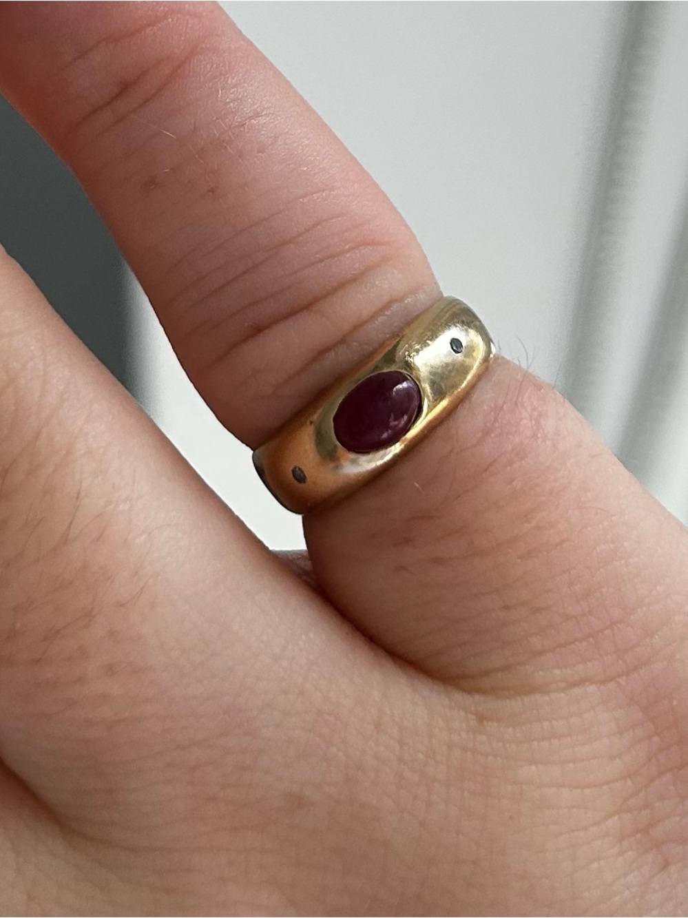 14 karat red stone pinky ring with two diamonds